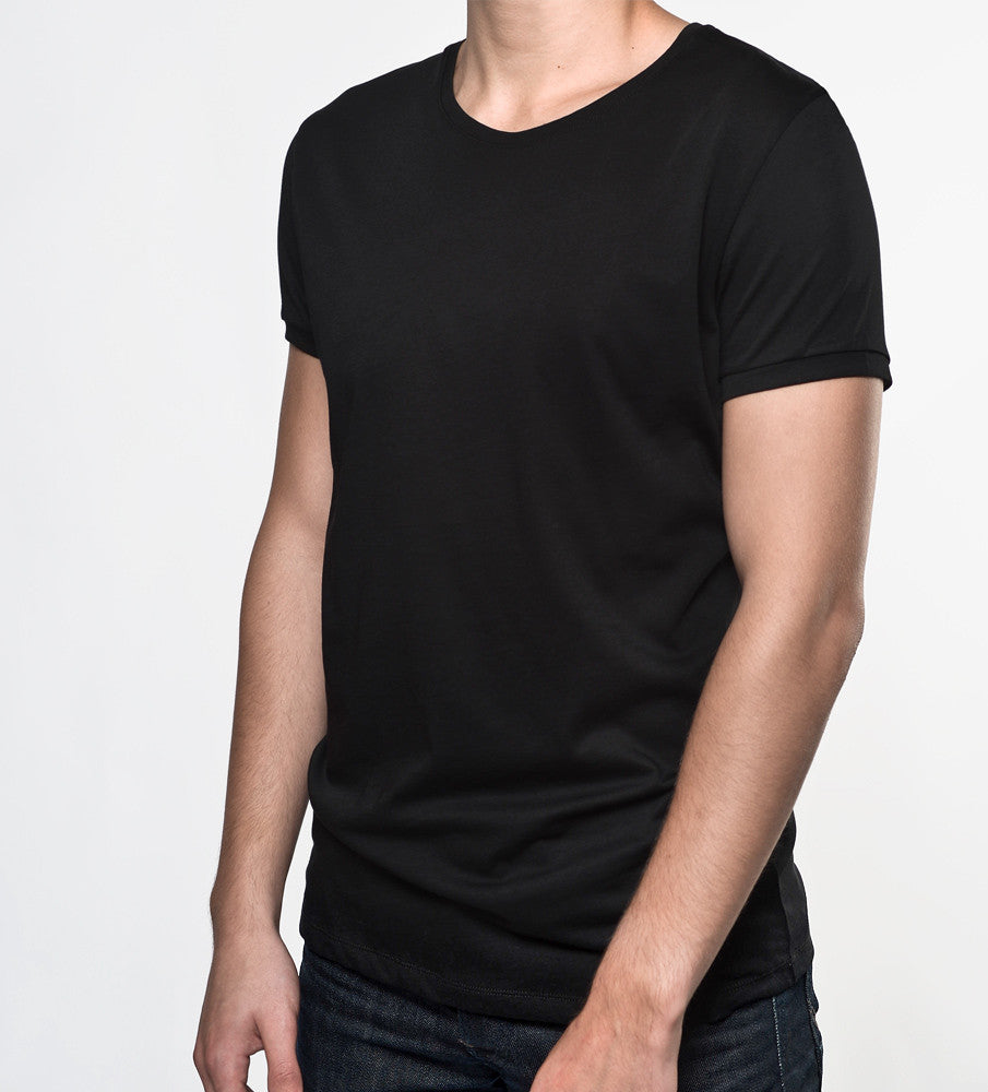 Man in a black supima cotton t shirt from front